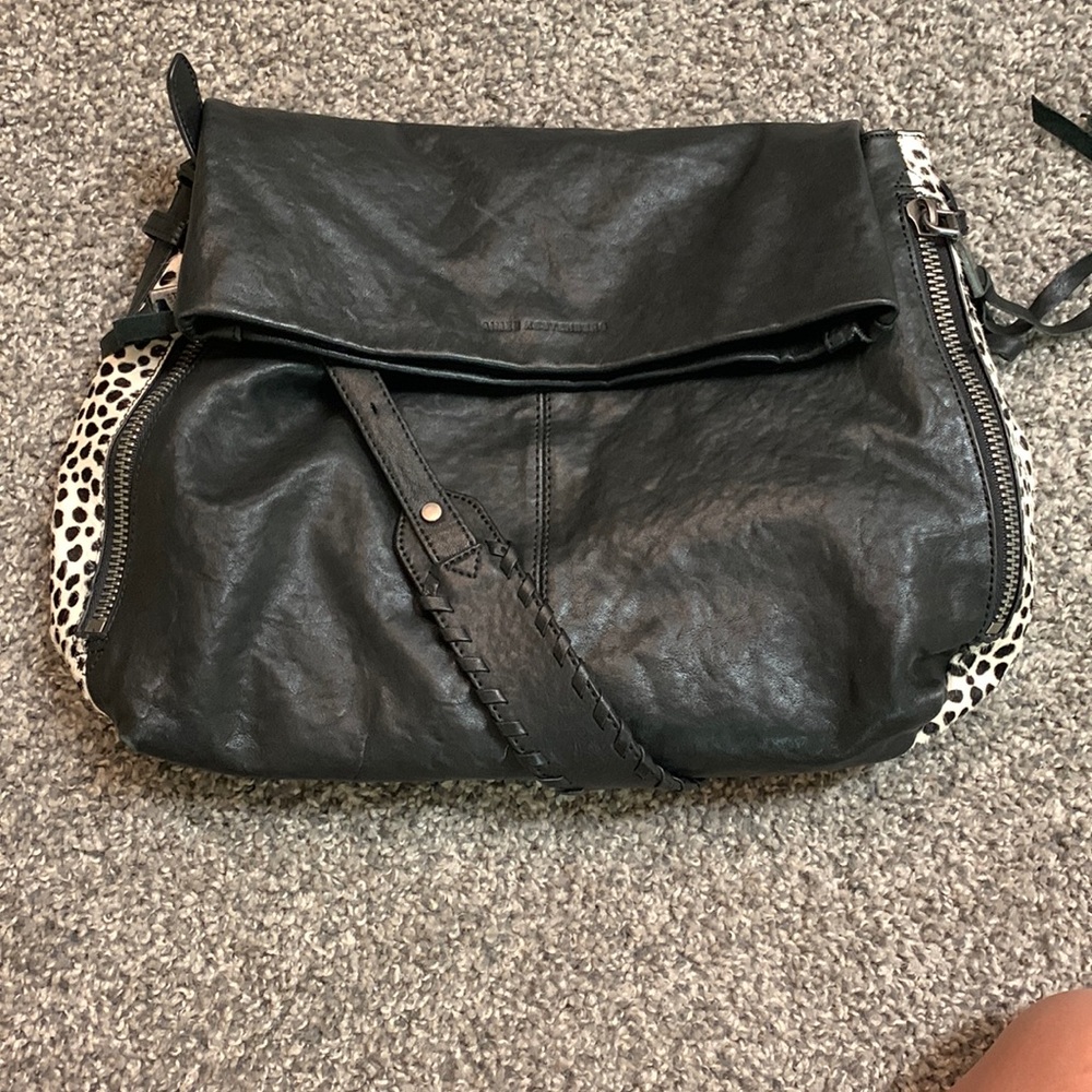 Black purse with fur on the side